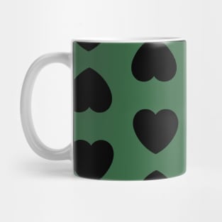 Black Hearts Pattern on a Green Background Mug